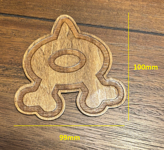 Stained basswood fridge magnet of a the Team Aqua logo from the Pokemon video games