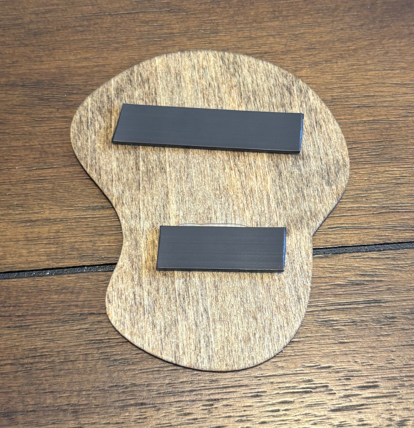 Stained basswood fridge magnet of the Dignity drawing from the Simpsons