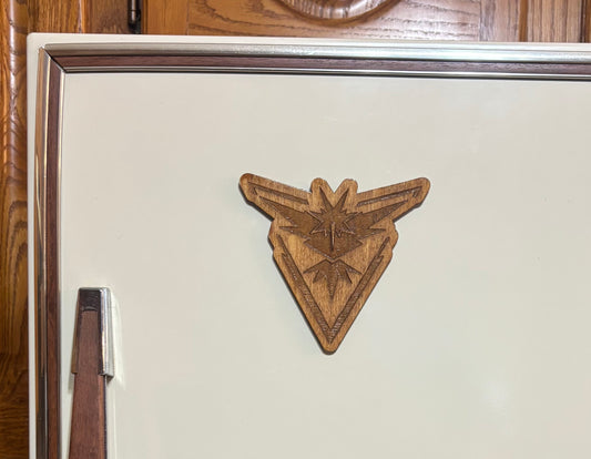 Stained basswood fridge magnet of a the Team Instinct logo from the Pokemon video games