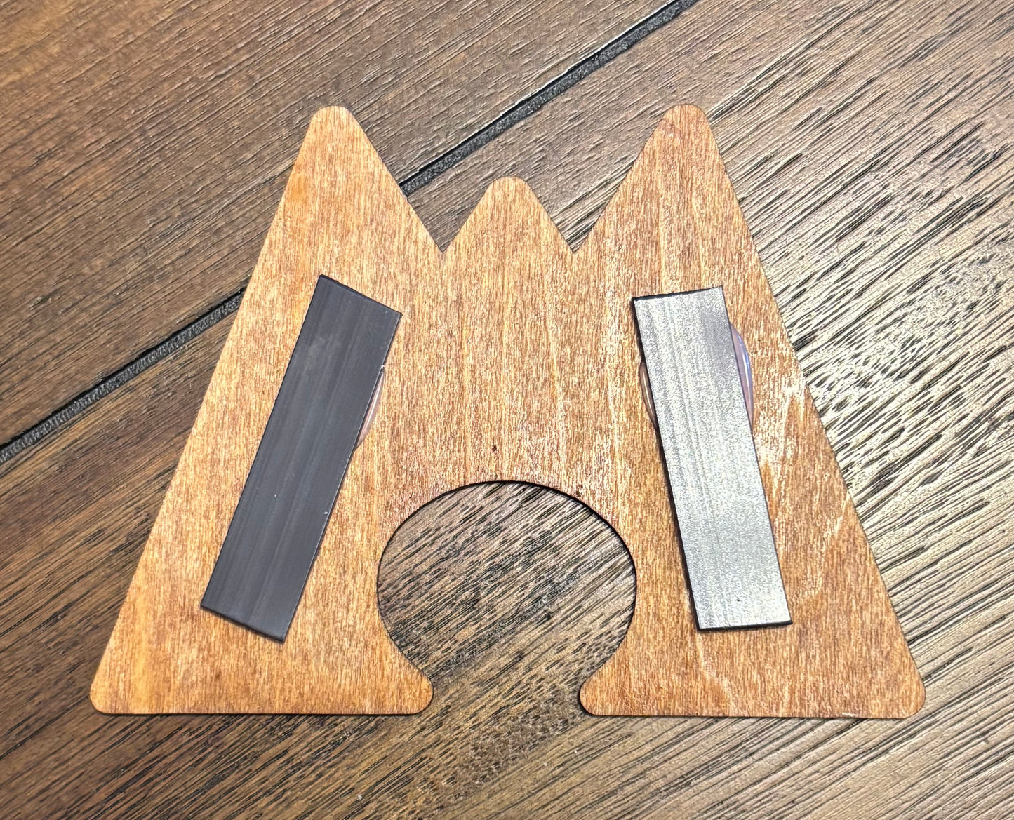 Stained basswood fridge magnet of a the Team Magma logo from the Pokemon video games