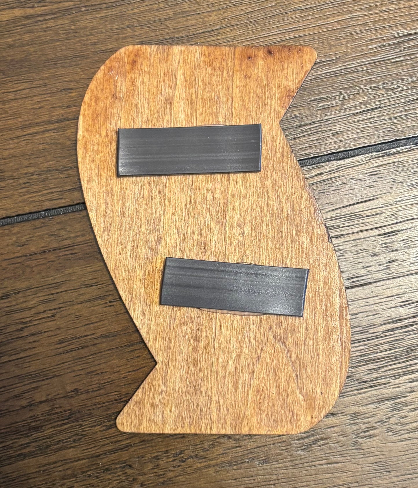 Stained basswood fridge magnet of a the Team Galactic logo from the Pokemon video games