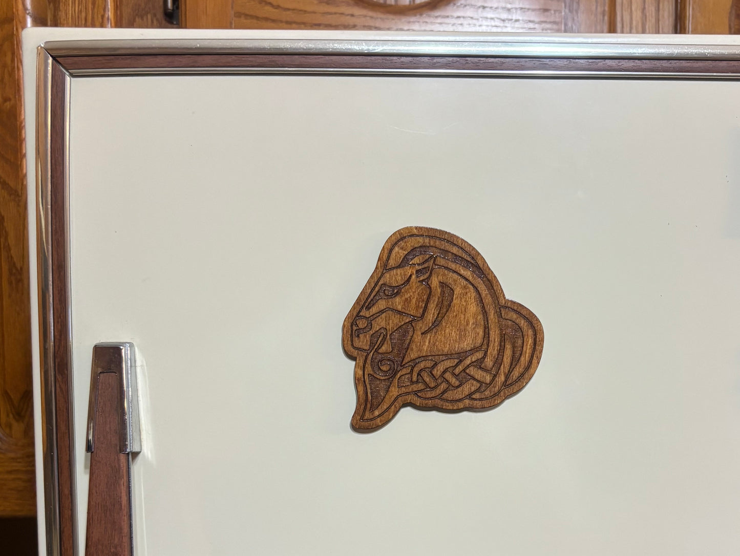 Stained basswood fridge magnet of the Whiterun sigil from the Skyrim video game