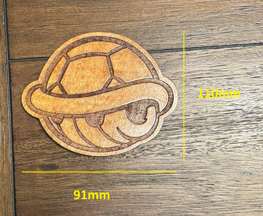 Stained basswood fridge magnet of a Turtle shell from the Mario video games