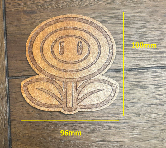 Stained basswood fridge magnet of a Flower power up from the Mario video games