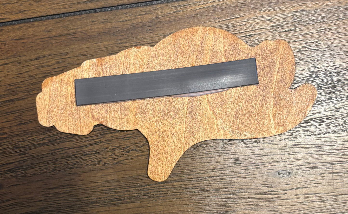 Stained basswood fridge magnet of the Denver Broncos football team logo