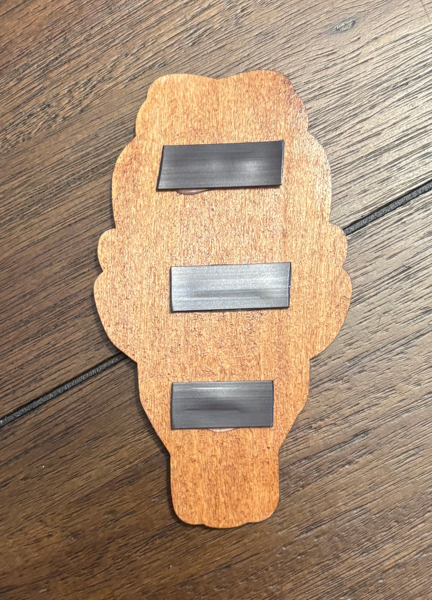 Stained basswood fridge magnet of the Falkreath sigil from the Skyrim video game