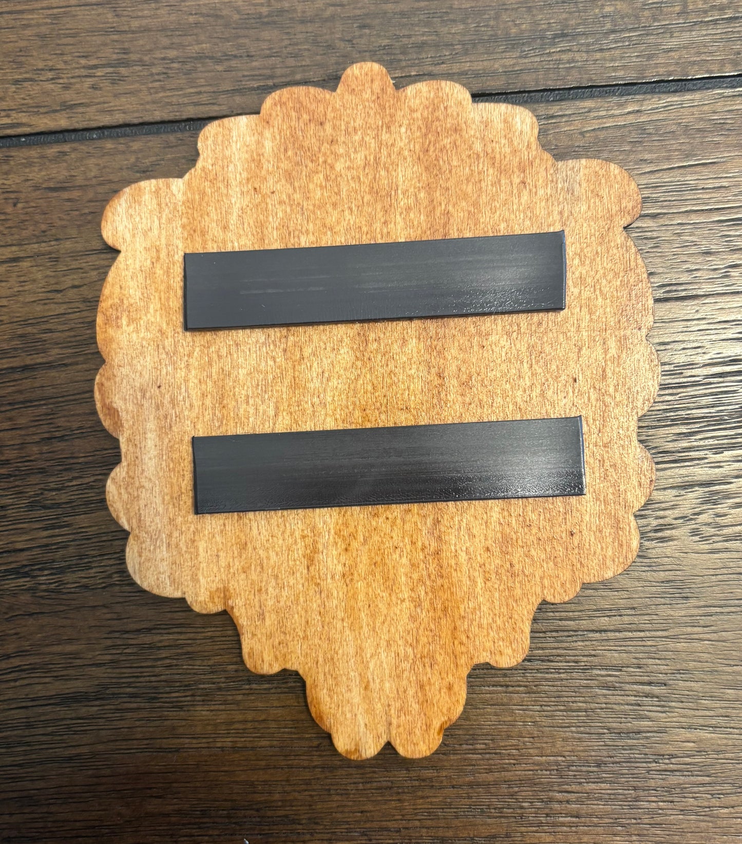 Stained basswood fridge magnet of a the Alliance symbol from the Warcraft video games