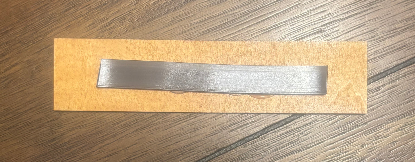 Stained basswood fridge magnet of the Tediore logo from the Borderlands video games