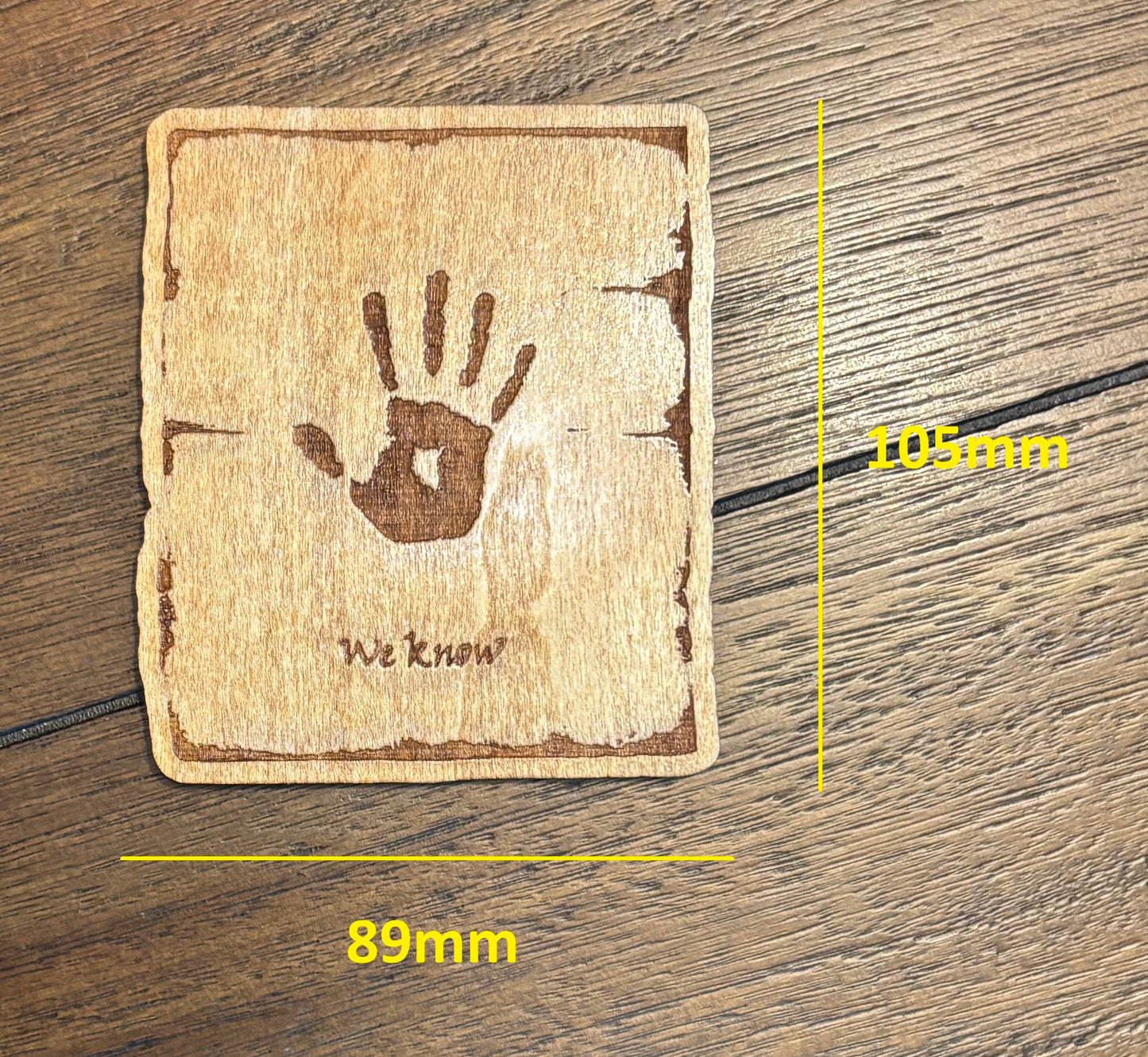 Stained basswood fridge magnet of the We Know note from the Skyrim video game