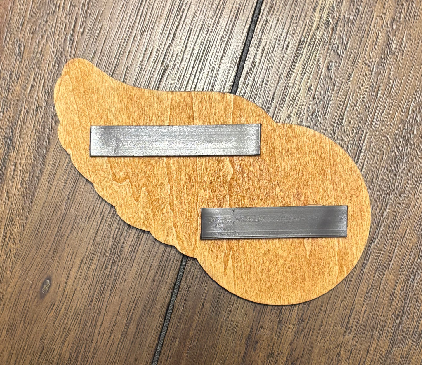 Stained basswood fridge magnet of the Detroit Red Wings hockey team logo