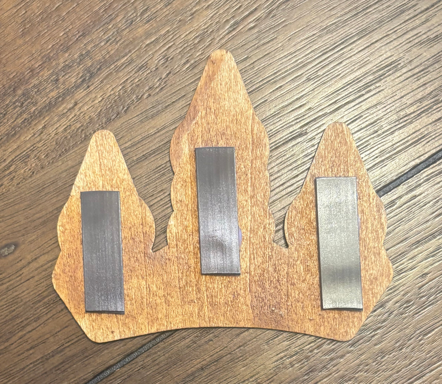 Stained basswood fridge magnet of the Winterhold sigil from the Skyrim video game