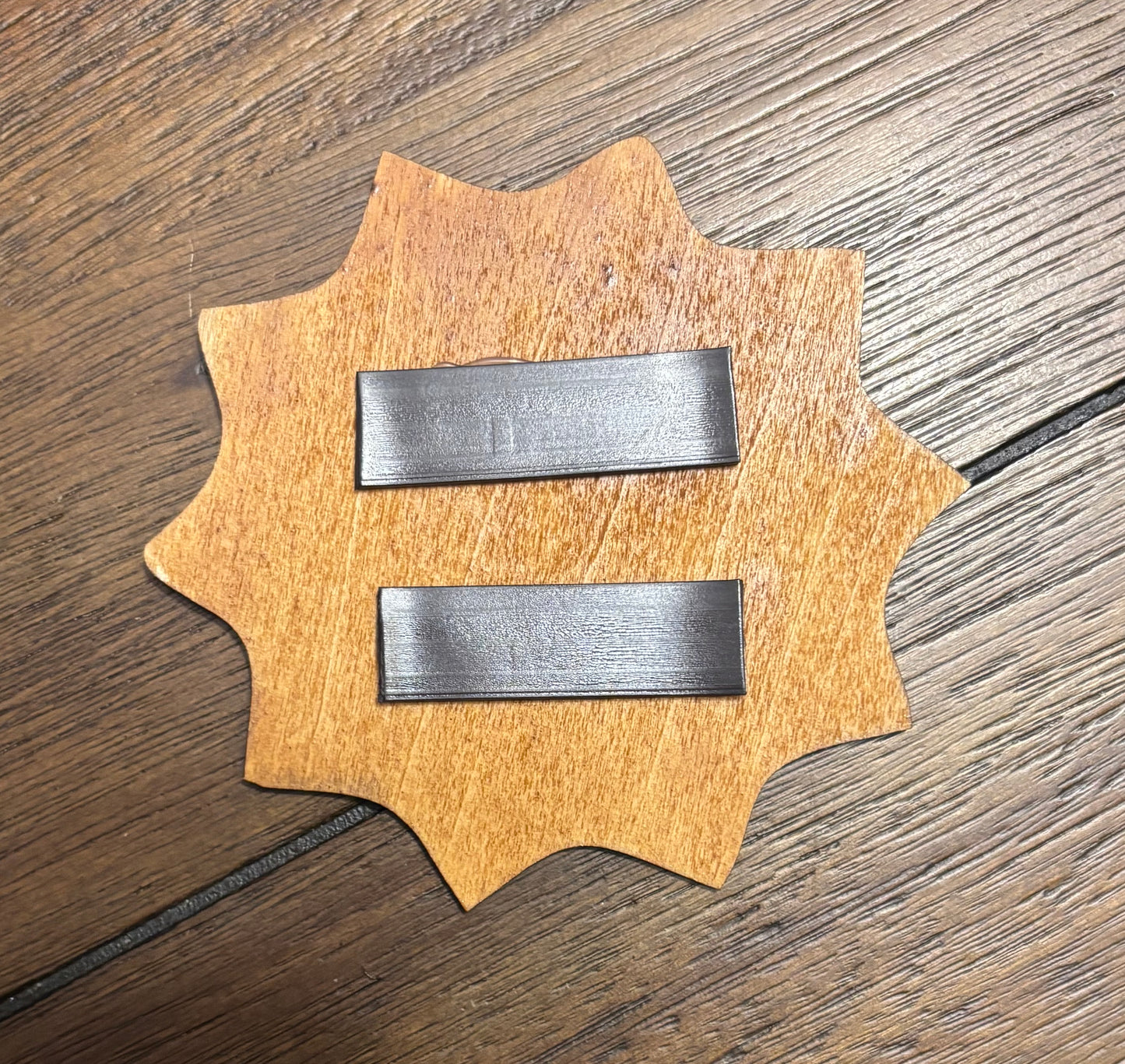Stained basswood fridge magnet of the Series Sam logo
