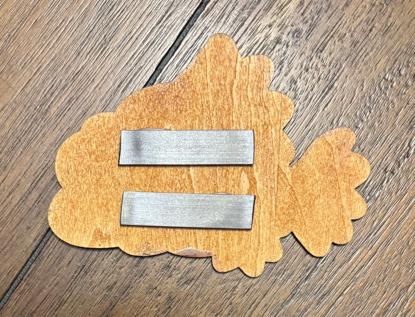 Stained basswood fridge magnet of Blinky from the Simpsons