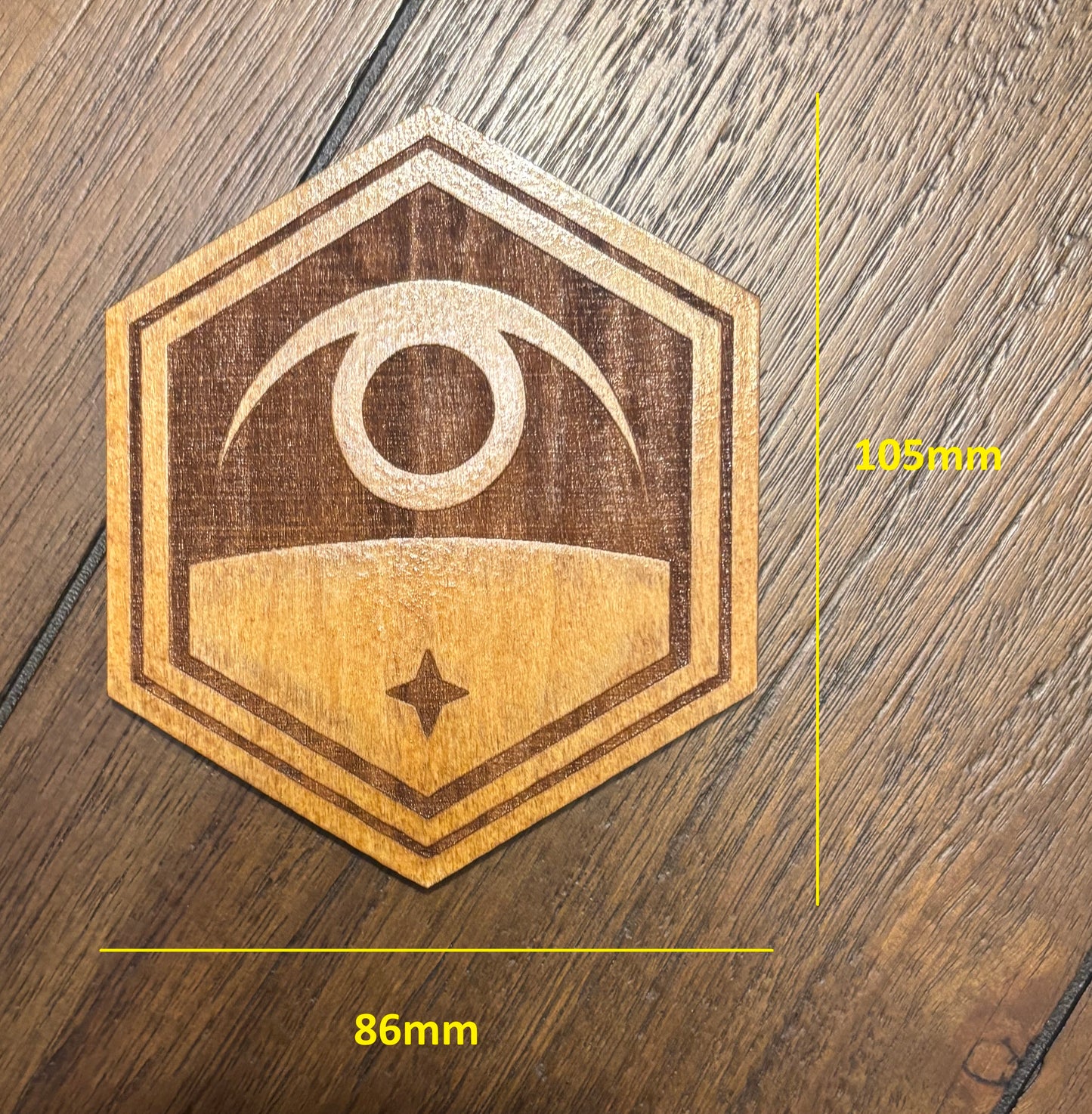 Stained basswood fridge magnet of the Exalt logo from the X-COM video games