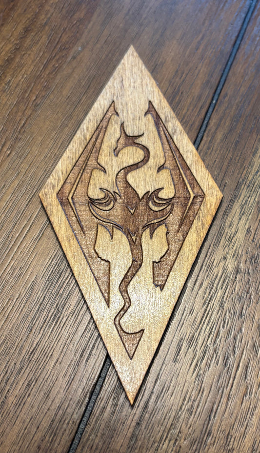 Stained basswood fridge magnet of the Skyrim icon from the Skyrim video game