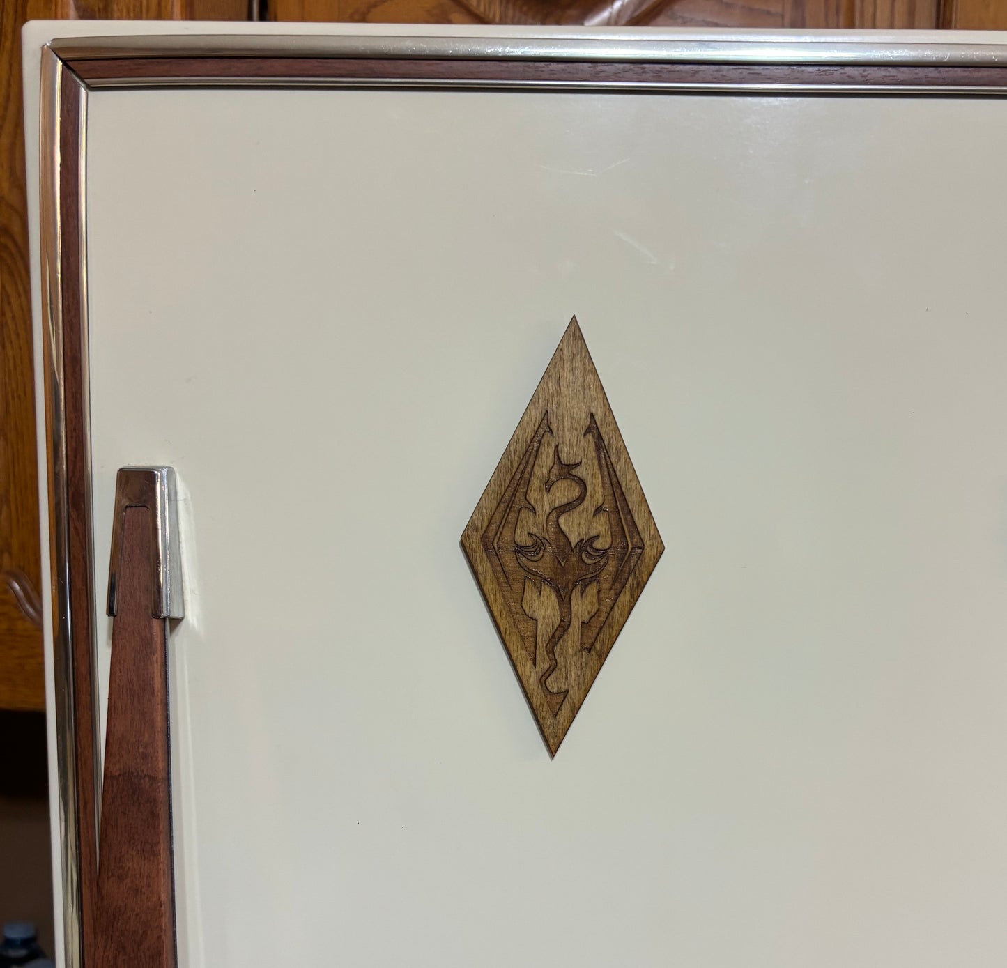 Stained basswood fridge magnet of the Skyrim icon from the Skyrim video game