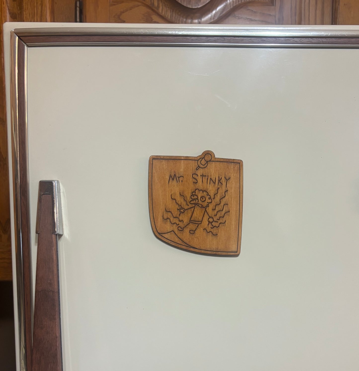 Stained basswood fridge magnet of the Mr Stinky drawing from the Simpsons