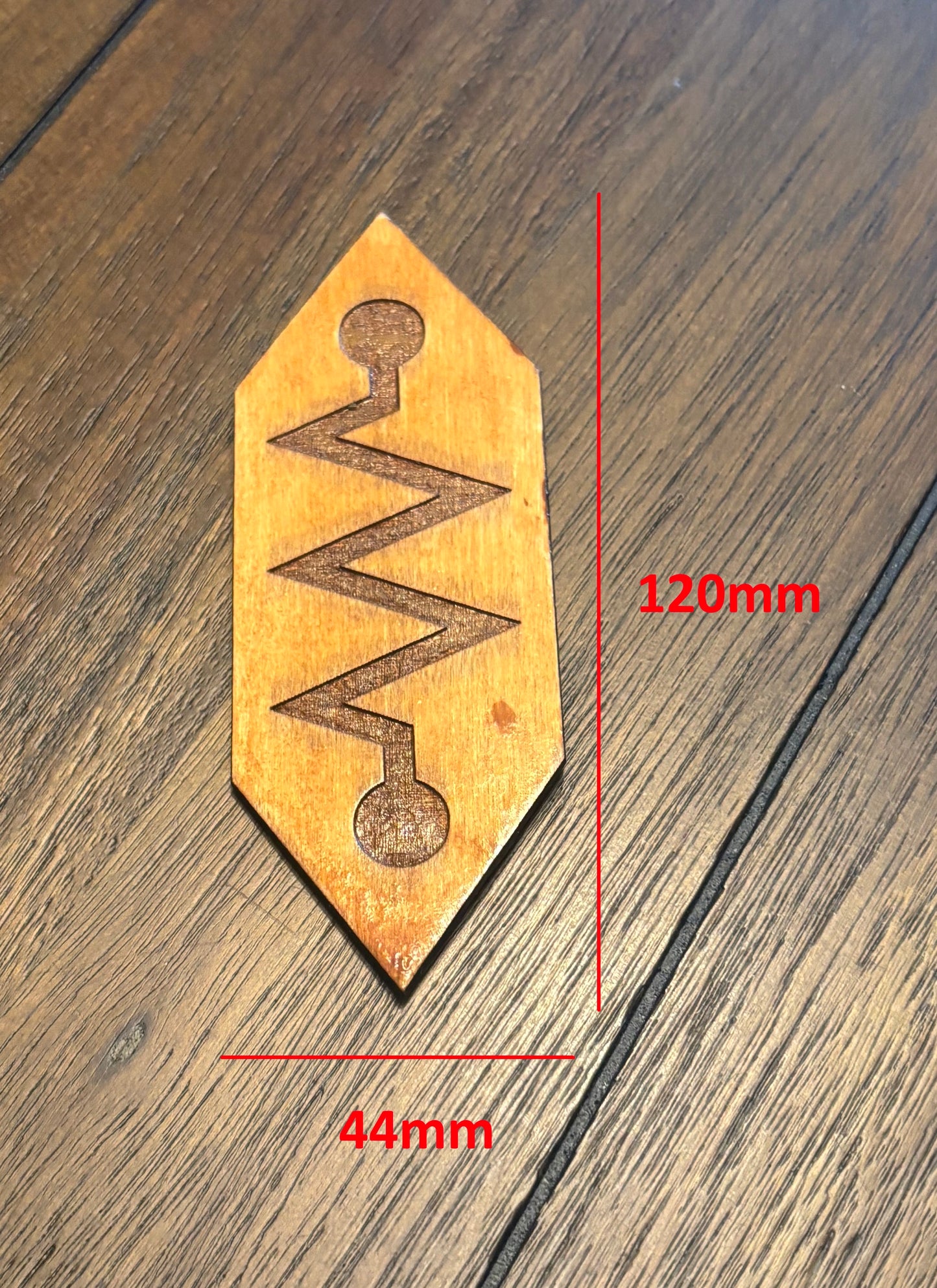 Stained basswood fridge magnet of the Church of Robotology logo from Futurama