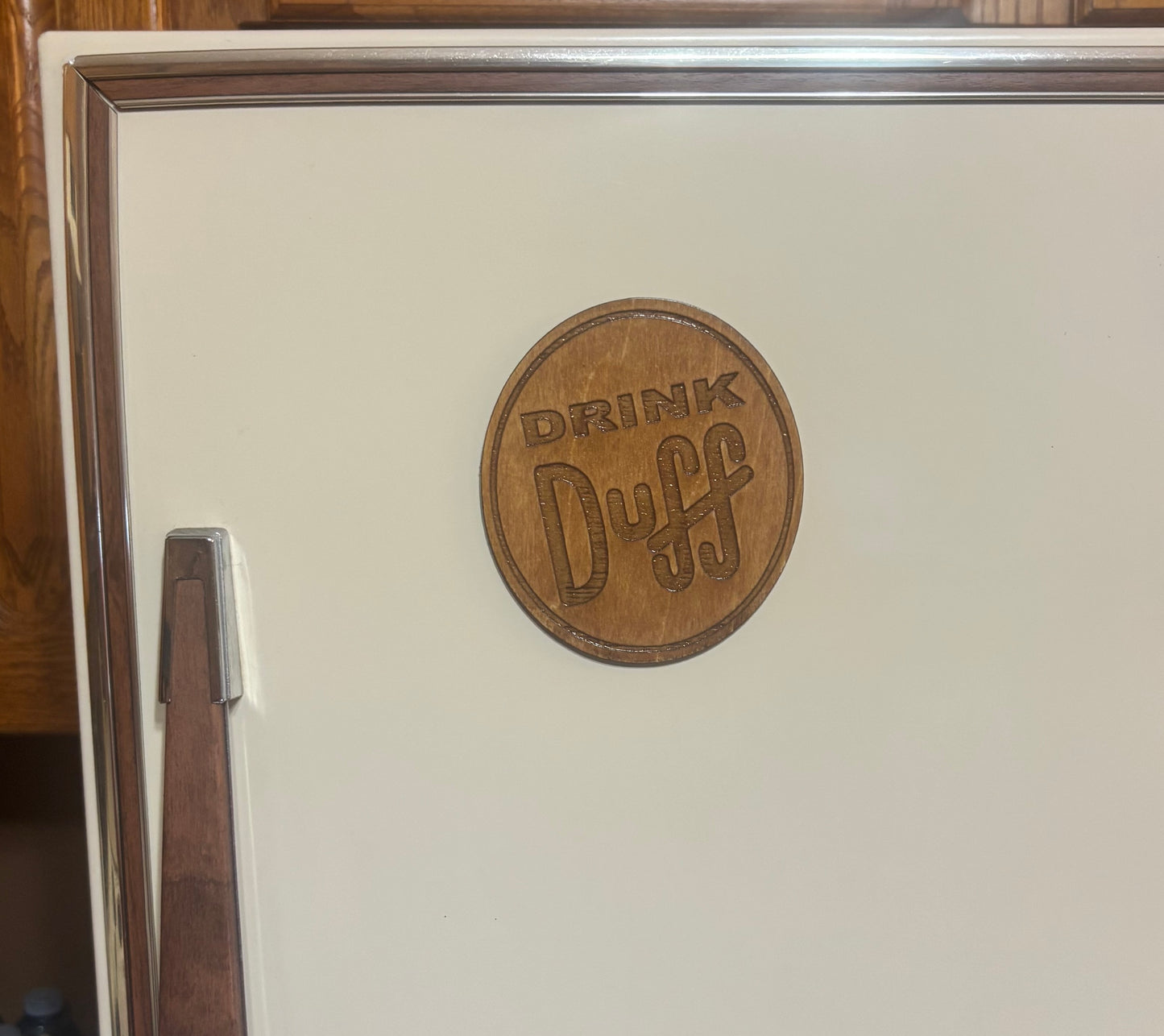 Stained basswood fridge magnet of the Drink Duff sticker from the Simpsons