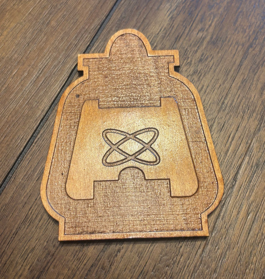 Stained basswood fridge magnet of the Railroad logo from the Fallout video games