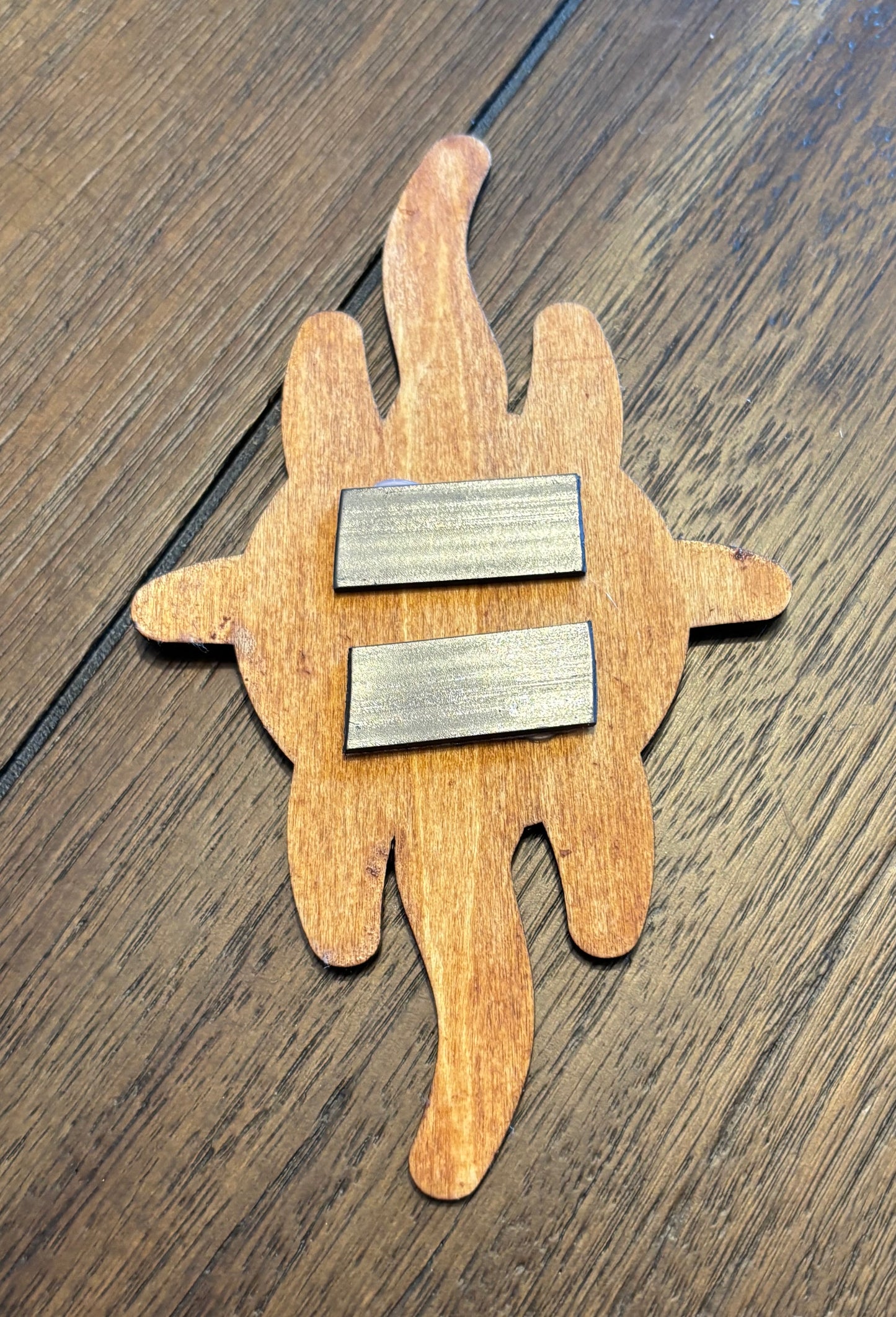 Stained basswood fridge magnet of the Church of Yivo logo from Futurama