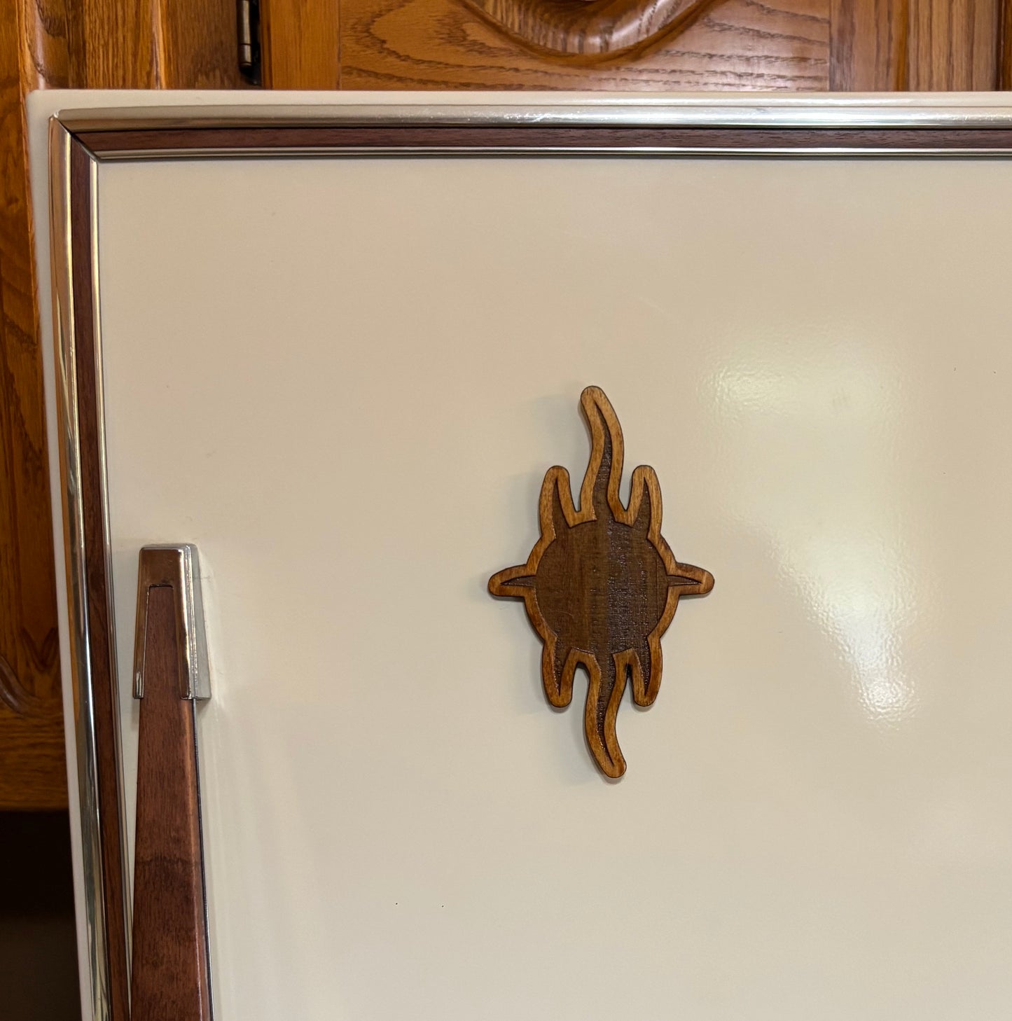Stained basswood fridge magnet of the Church of Yivo logo from Futurama
