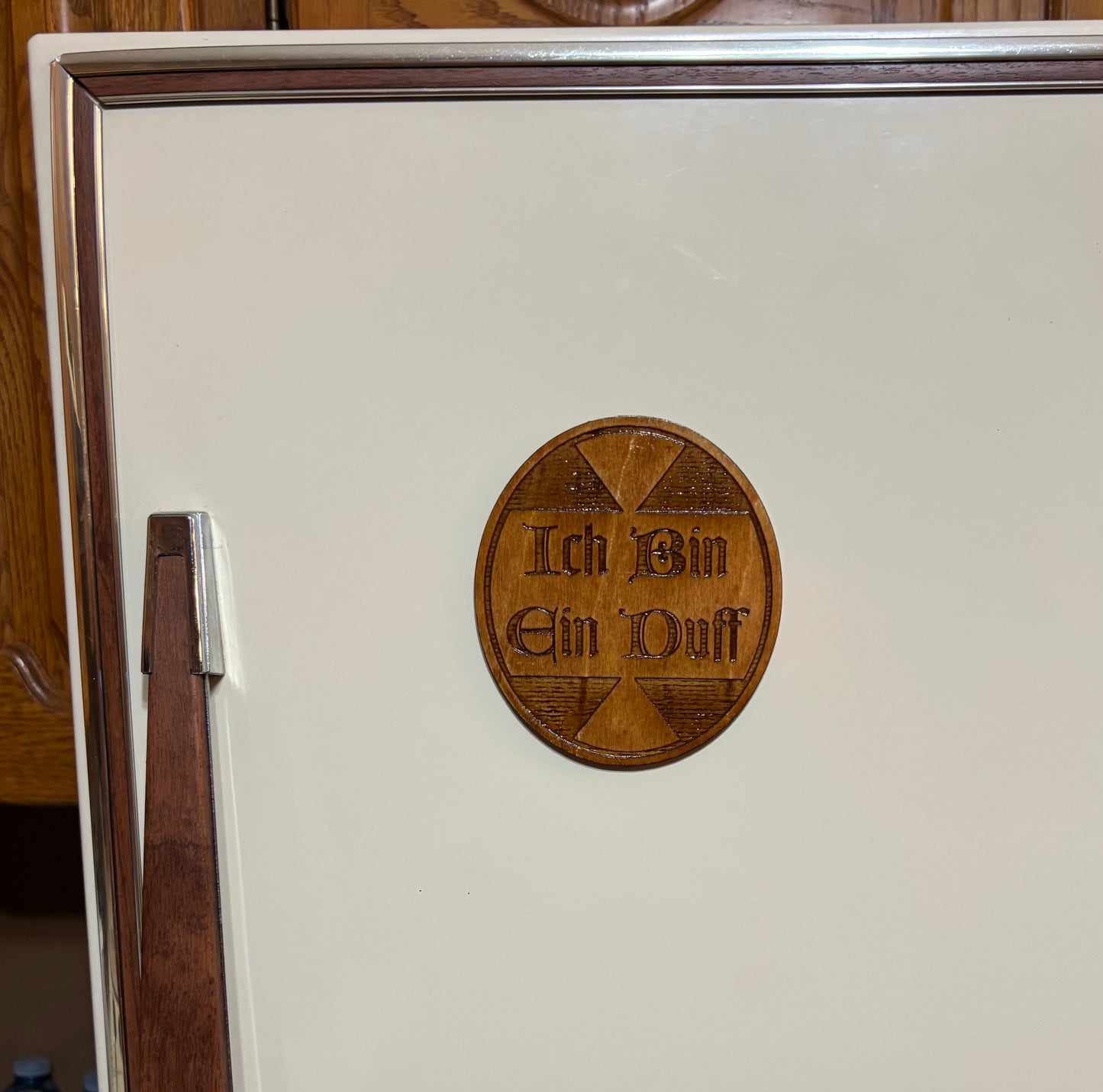 Stained basswood fridge magnet of the Ich bin ein Duff sticker from the Simpsons