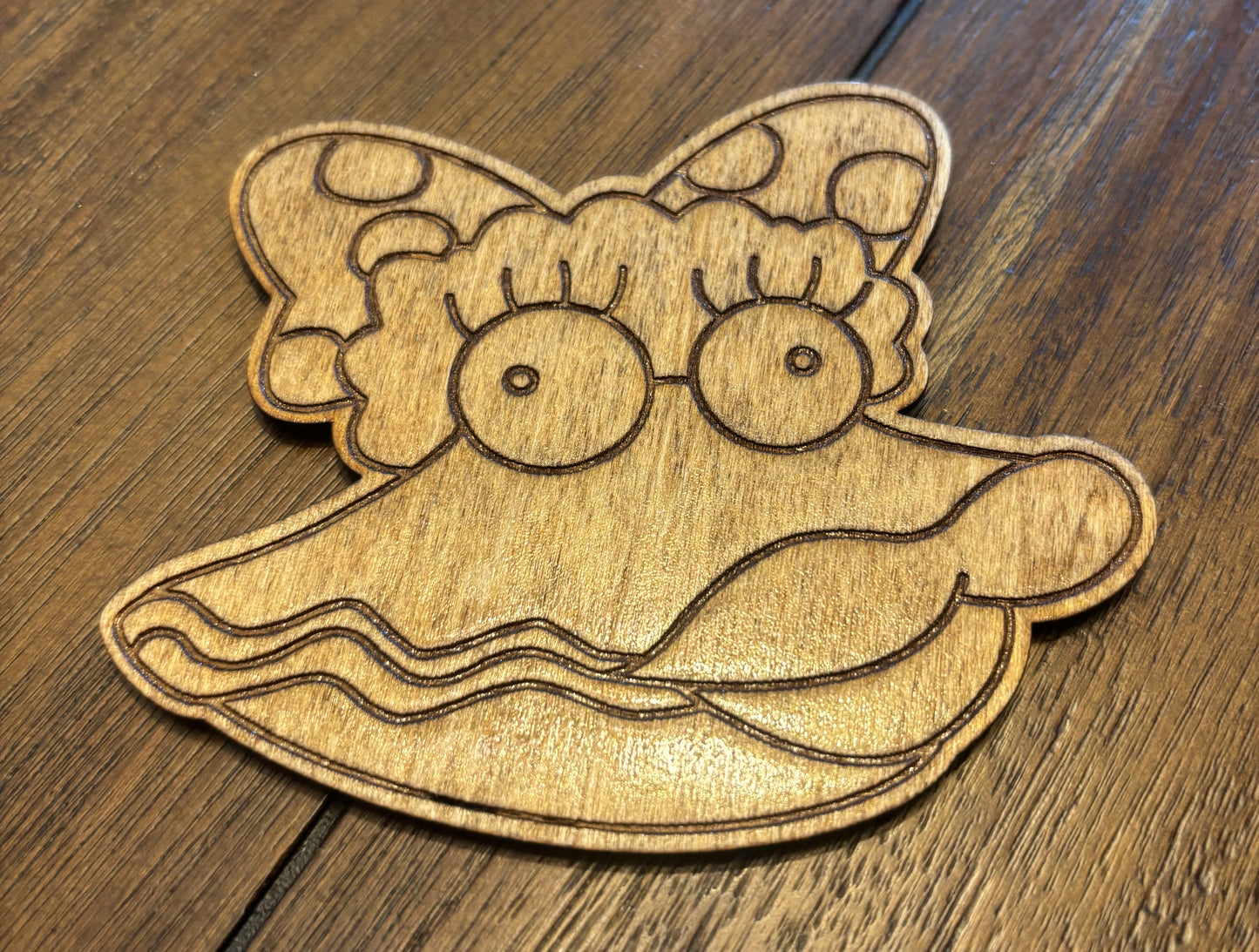 Stained basswood fridge magnet of Oyster Lucy from the Simpsons