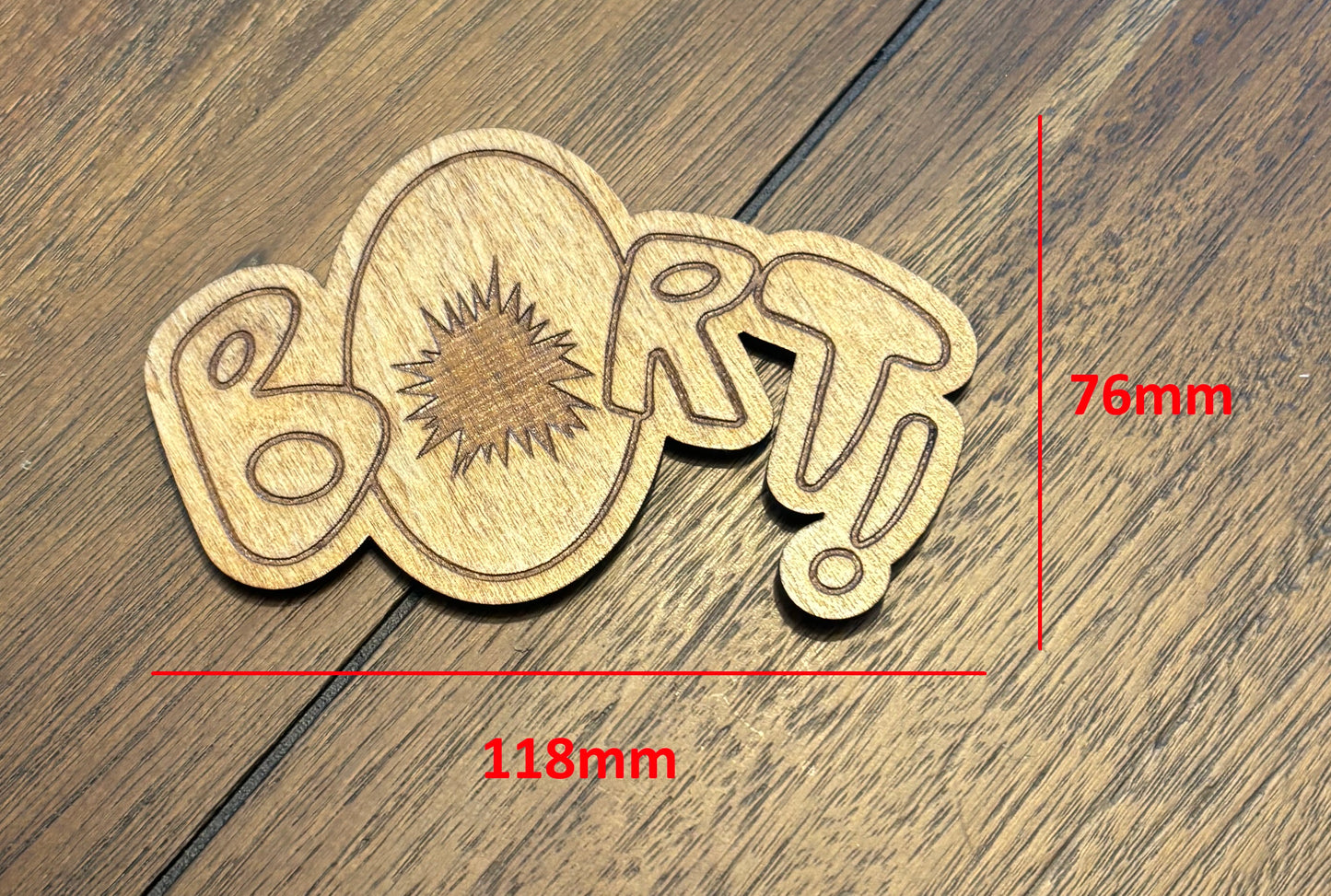Stained basswood fridge magnet of the Bort sound effect from the Simpsons