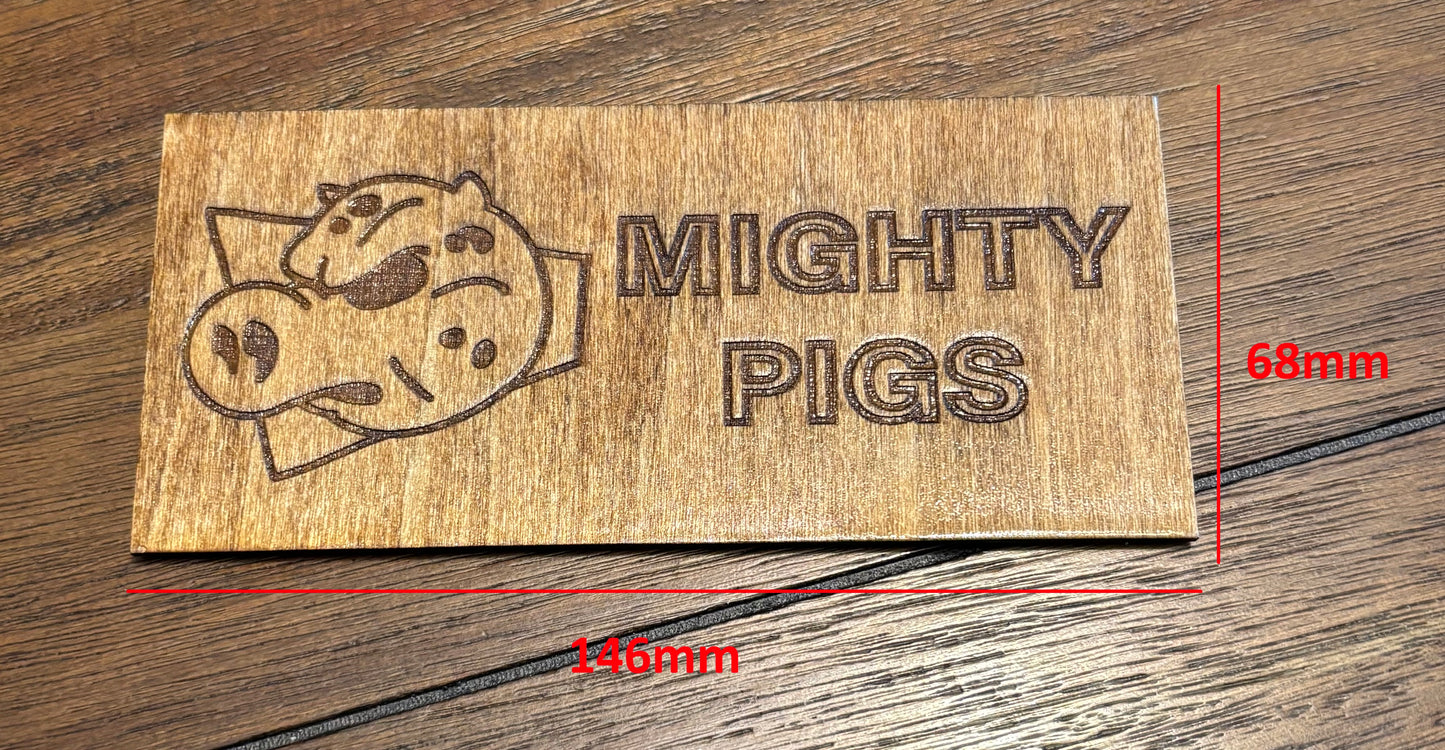 Stained basswood fridge magnet of the Mighty Pigs logo from the Simpsons