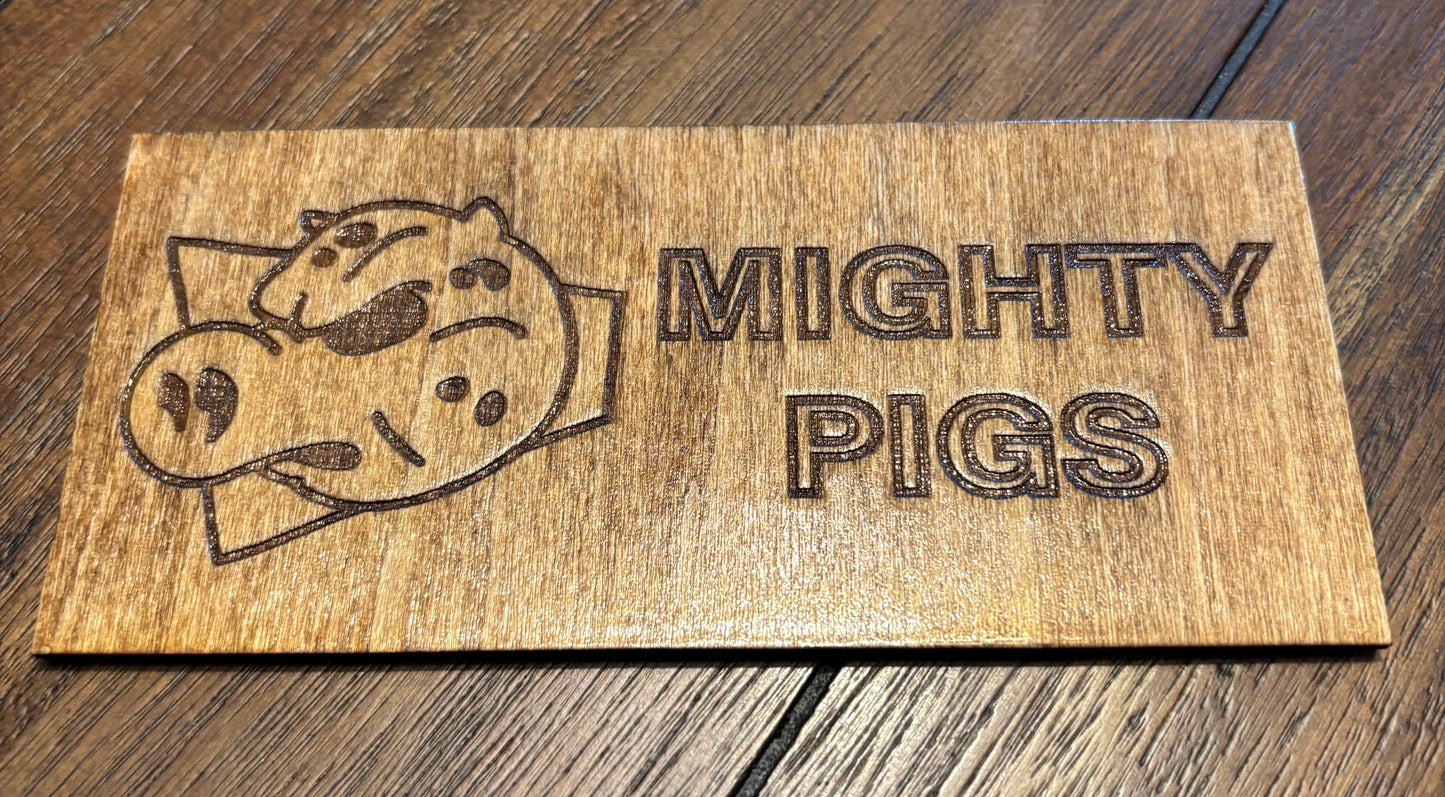 Stained basswood fridge magnet of the Mighty Pigs logo from the Simpsons