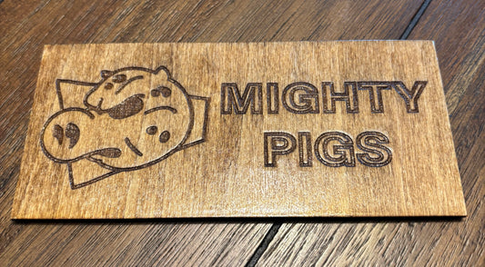 Stained basswood fridge magnet of the Mighty Pigs logo from the Simpsons