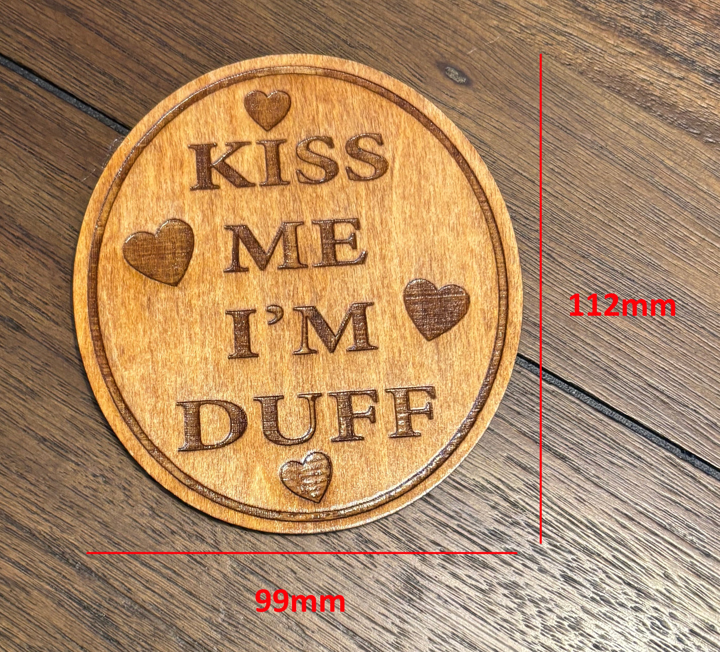 Stained basswood fridge magnet of the Kiss me I'm Duff sticker from the Simpsons