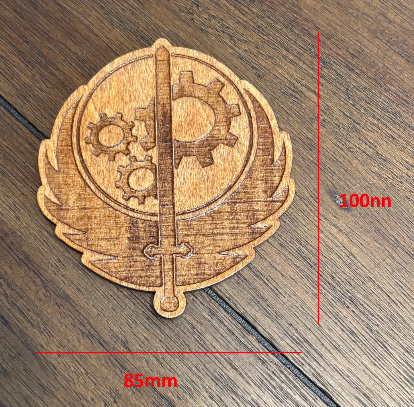Stained basswood fridge magnet of the Brotherhood of Steel logo from the Fallout video games