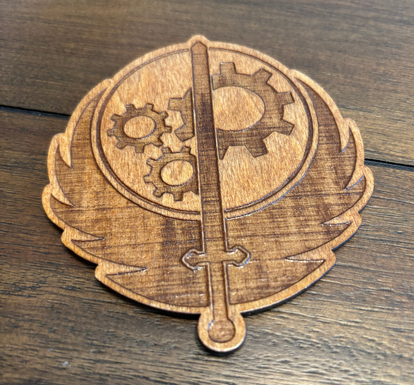 Stained basswood fridge magnet of the Brotherhood of Steel logo from the Fallout video games