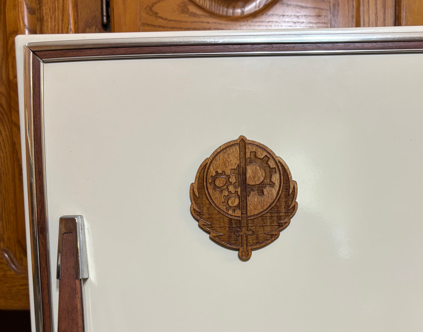 Stained basswood fridge magnet of the Brotherhood of Steel logo from the Fallout video games