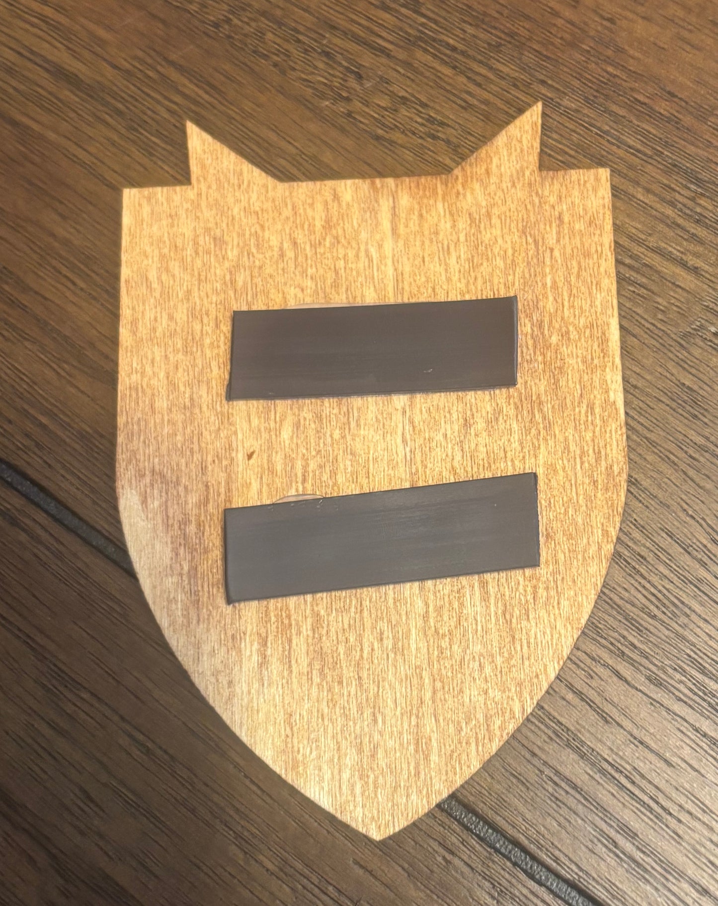 Stained basswood fridge magnet of the Solitude icon from the Skyrim video game