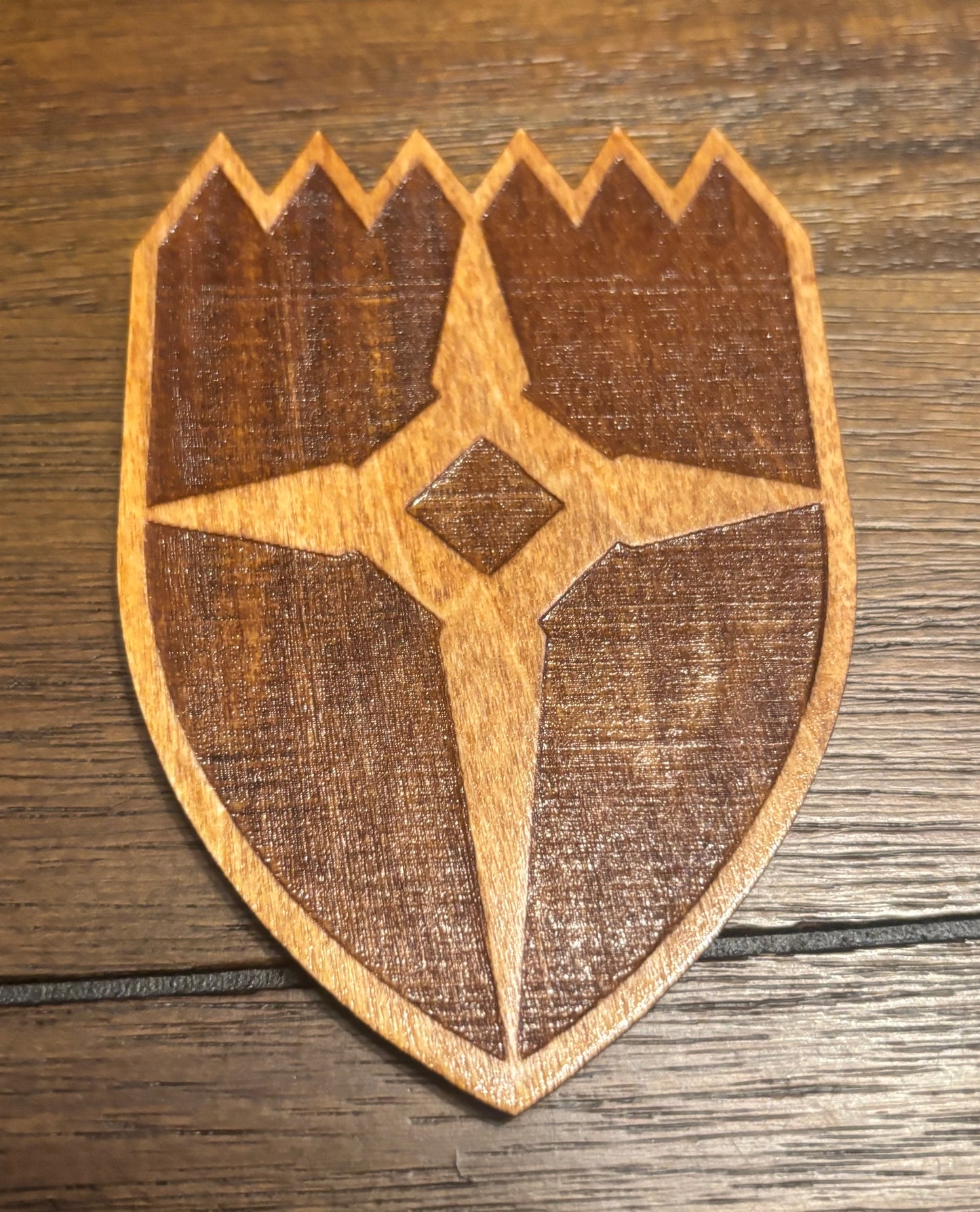 Stained basswood fridge magnet of the Dawnstar icon from the Skyrim video game
