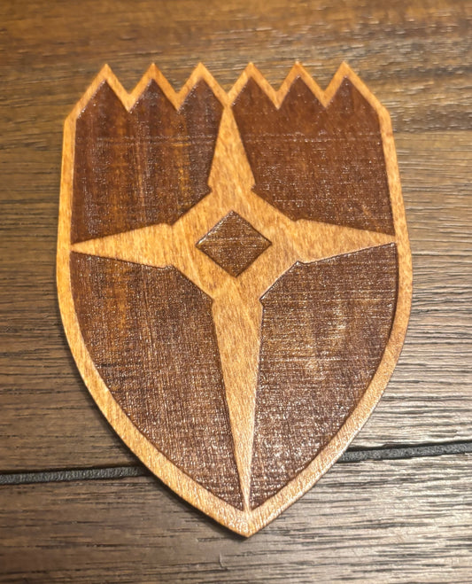 Stained basswood fridge magnet of the Dawnstar icon from the Skyrim video game
