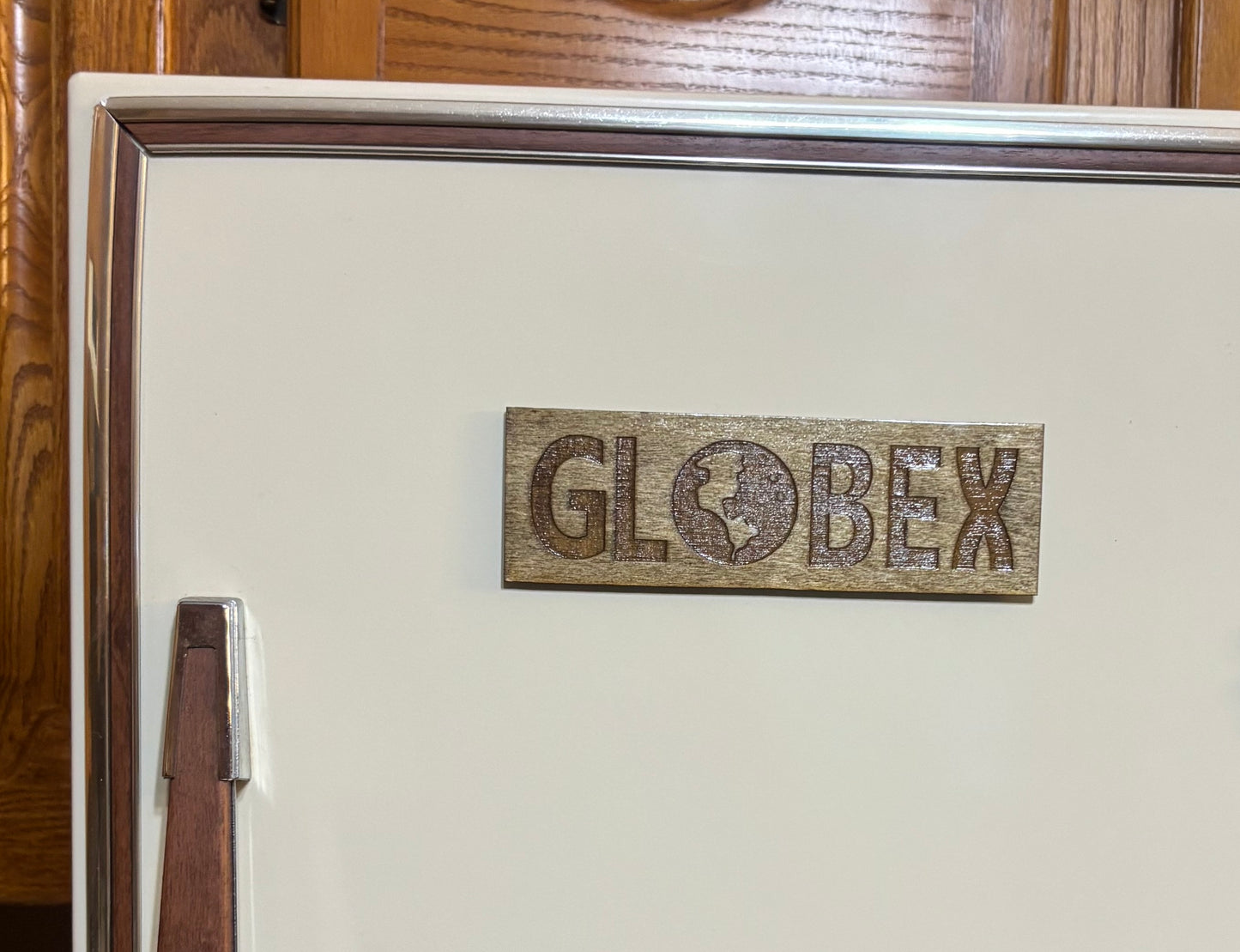 Stained basswood fridge magnet of the Globex Corporation logo from the Simpsons