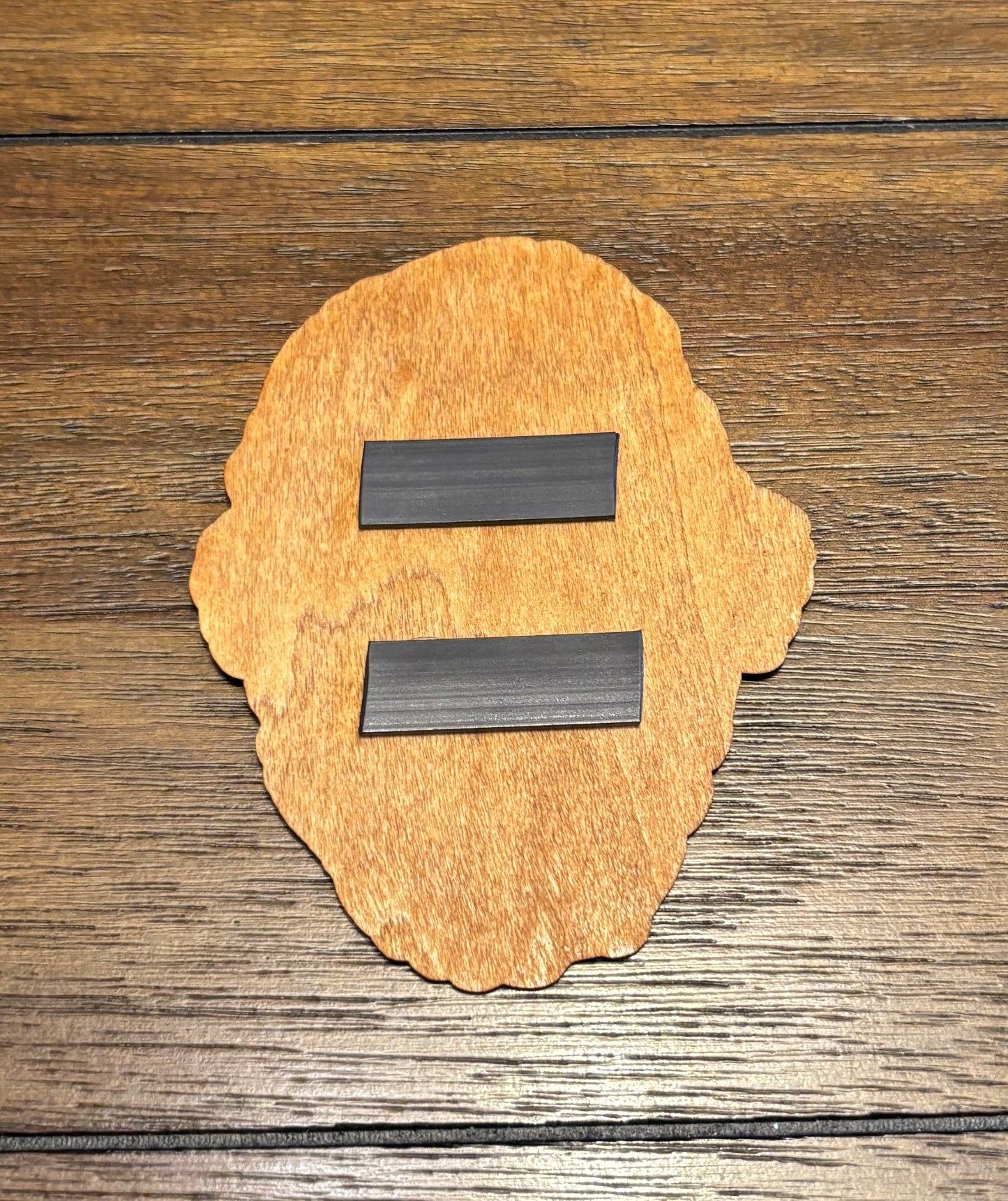Stained basswood fridge magnet of the Gunners logo from the Fallout video games