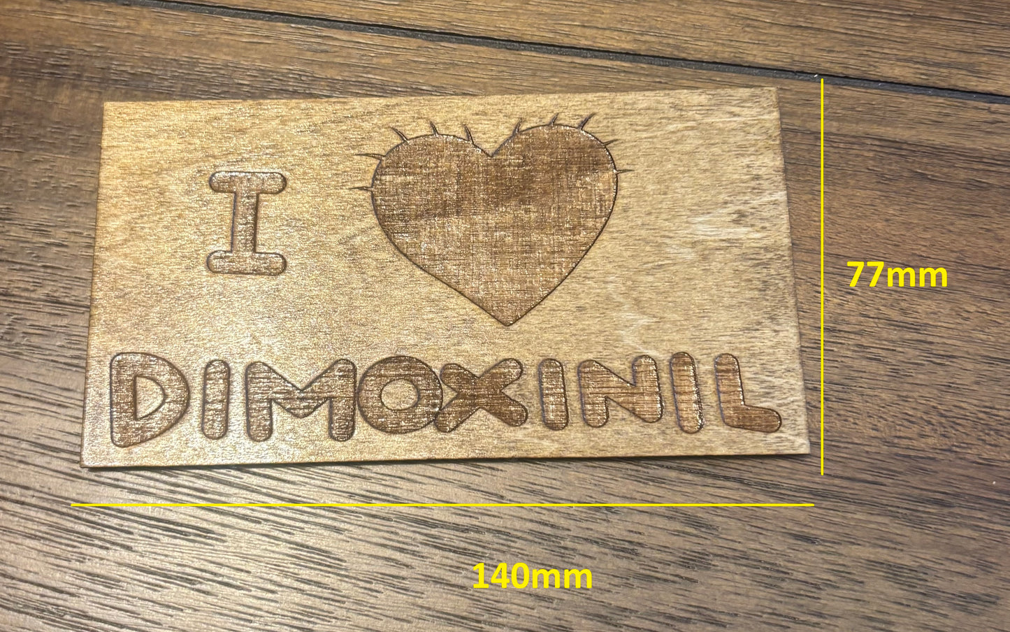 Stained basswood fridge magnet of the I love Demoxinil shirt from the Simpsons