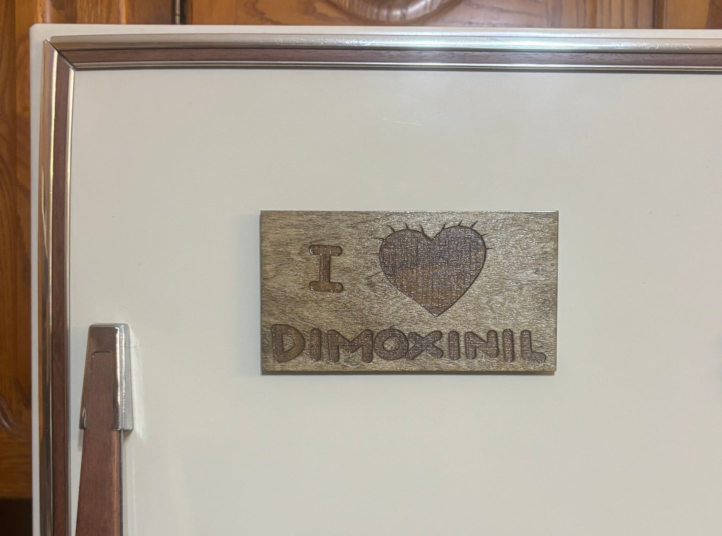 Stained basswood fridge magnet of the I love Demoxinil shirt from the Simpsons