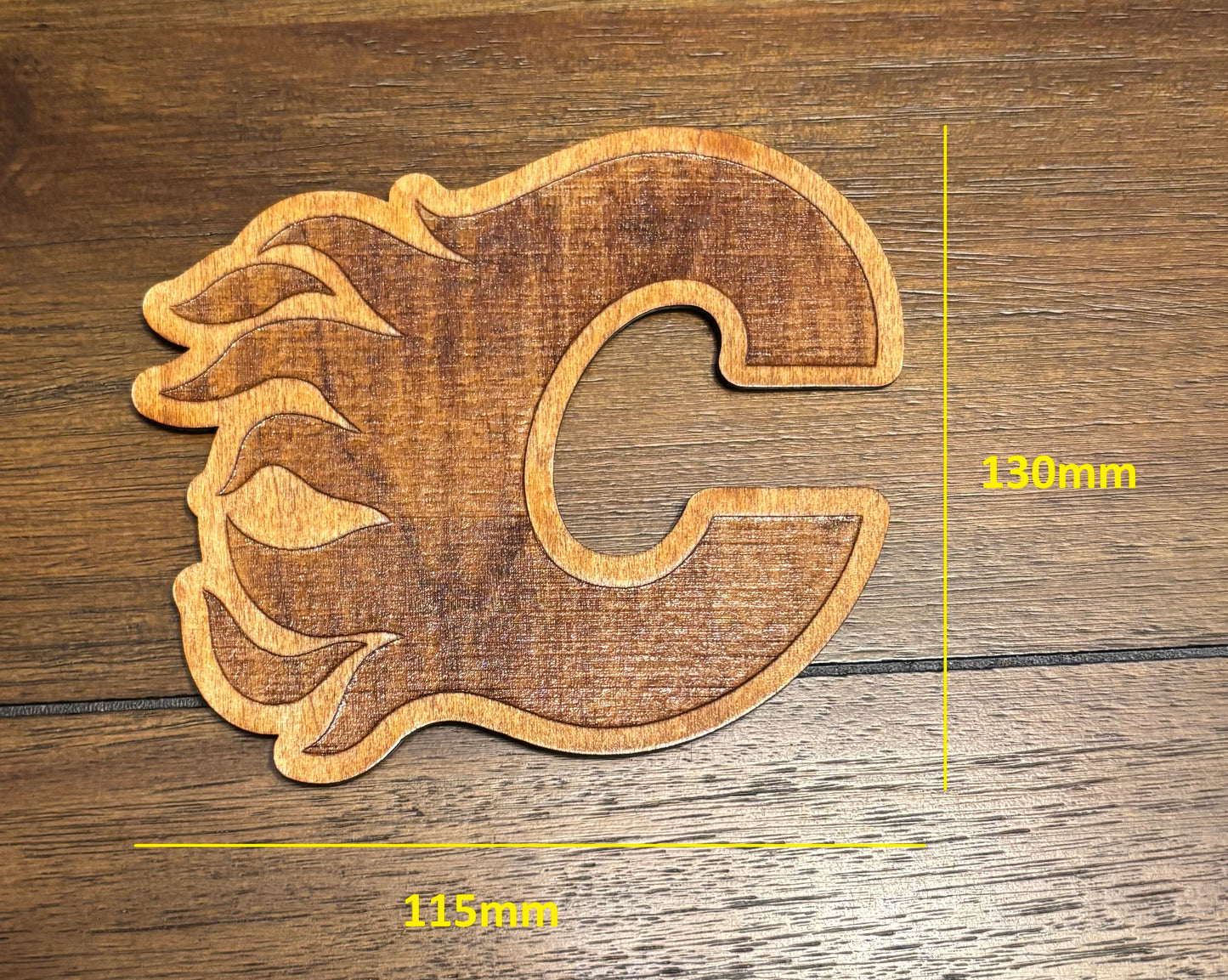 Stained basswood fridge magnet of the Calgary Flames hockey team logo