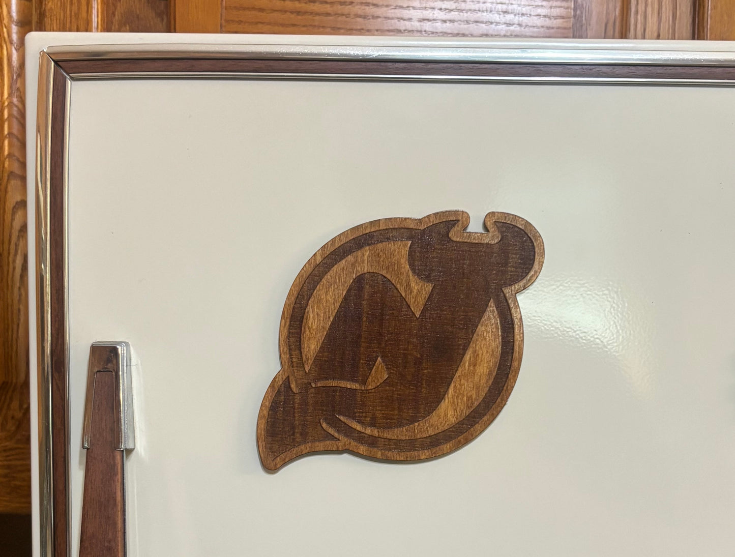 Stained basswood fridge magnet of the New Jersey Devils hockey team logo