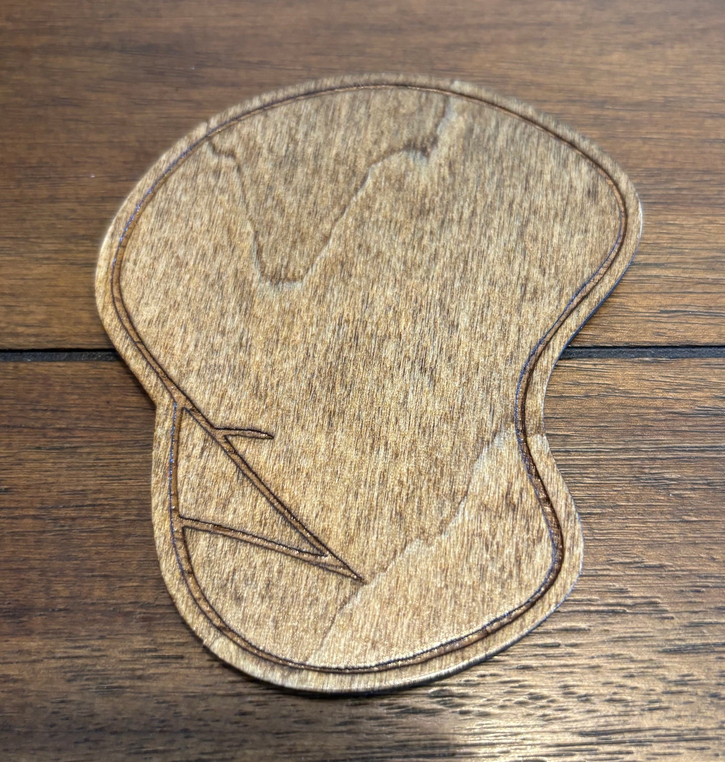 Stained basswood fridge magnet of the Dignity drawing from the Simpsons
