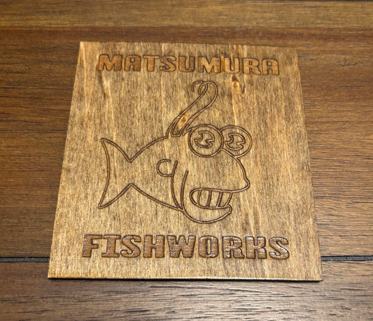 Stained basswood fridge magnet of the Matsumura logo from the Simpsons