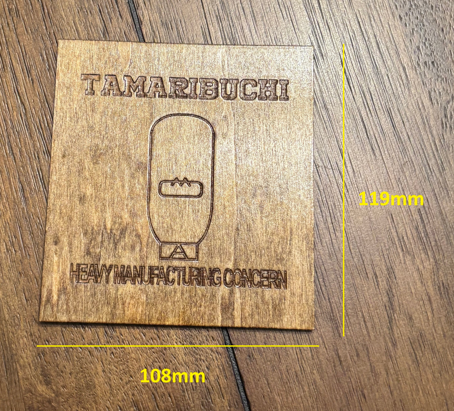 Stained basswood fridge magnet of the Tamaribuchi logo from the Simpsons