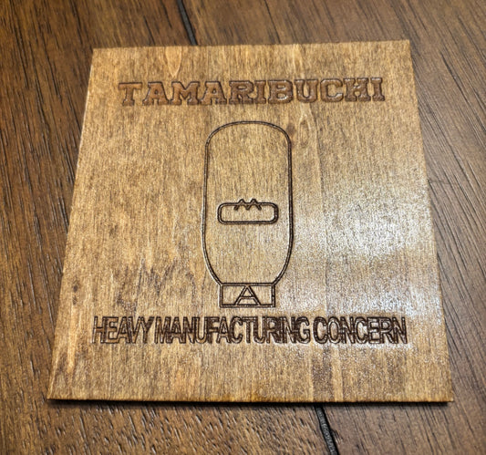 Stained basswood fridge magnet of the Tamaribuchi logo from the Simpsons