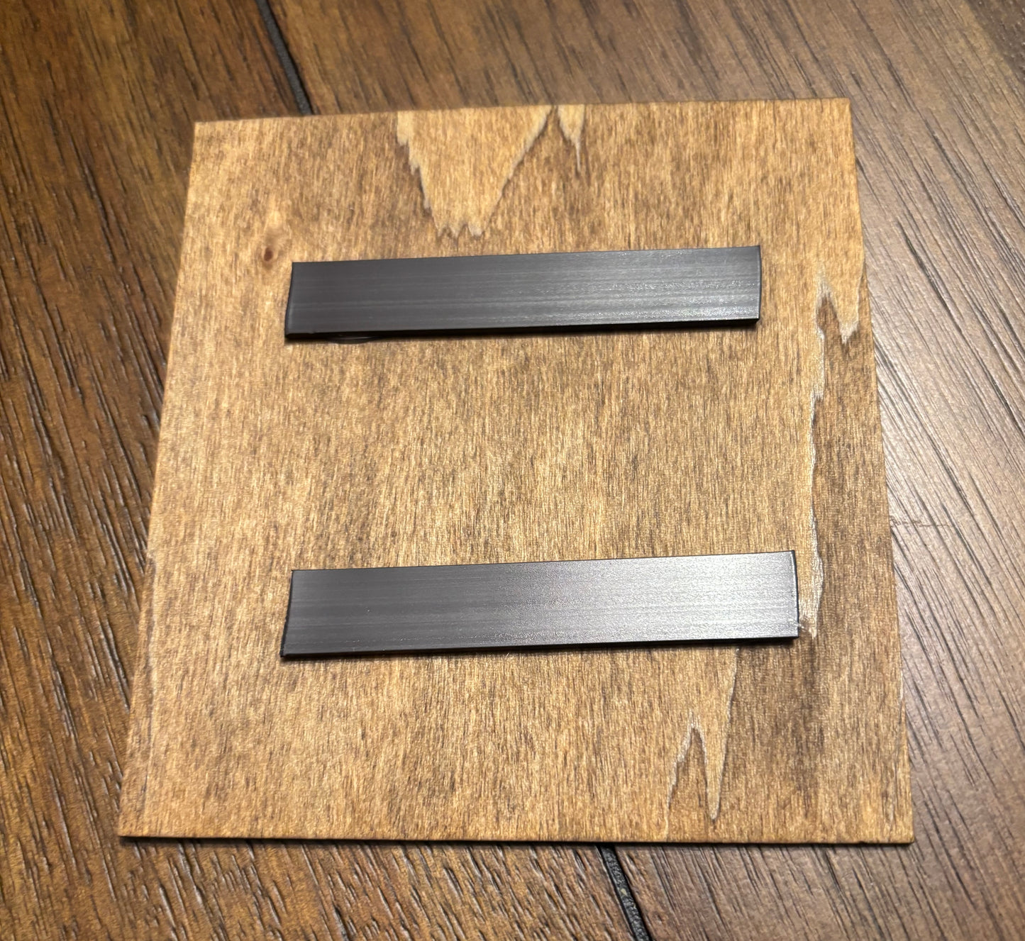 Stained basswood fridge magnet of the Tamaribuchi logo from the Simpsons